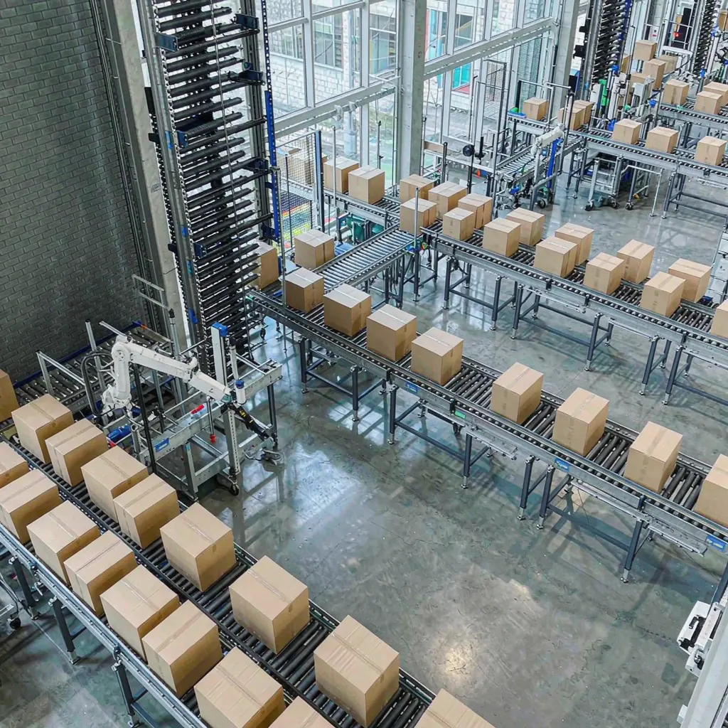 Warehouse conveyor system transporting cardboard boxes in distribution center